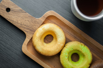 donuts on rectangle wooden pan.
