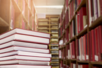 Old open book with a vintage library background