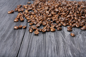 Coffee beans on wood background
