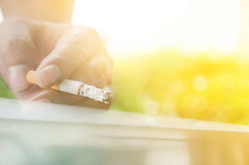 Man smoking cigarettes.