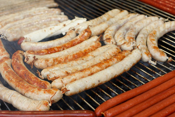Street fast food, grilled sausages at bbq