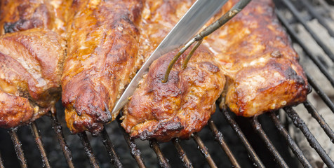 Cutting Up Meat on the Barbecue