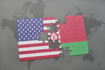 puzzle with the national flag of united states of america and belarus on a world map background