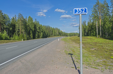 Milepost on the federal highway A121. Karelia, Russia.