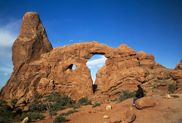 Hiker resting at Turret Arch, Arches National Park Moab Utah © geraldmarella