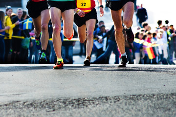 legs of runners at the marathon