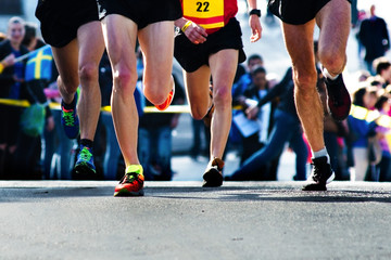 legs of runners at the marathon