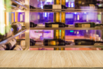 Wood floor with blur of alcohol bar background
