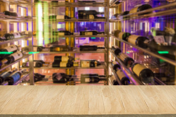Wood floor with blur of alcohol bar background