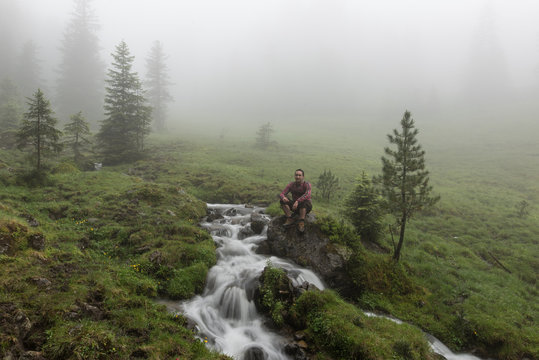Man in traditional Lederhosen in the Nature of Austria