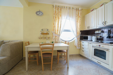 Interior of a guest house room with kitchen