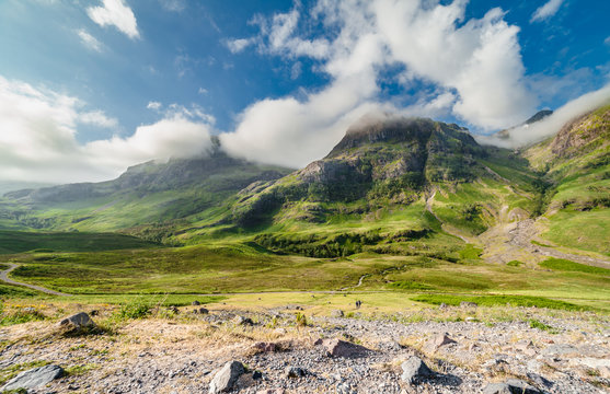 Bright Clouds Capped Summit of Glen Coe in Scottish Highlands at
