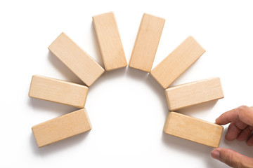 Hand aranging wood block stacking as step stair.