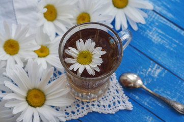 Obraz na płótnie Canvas Herbal tea in a glass mug