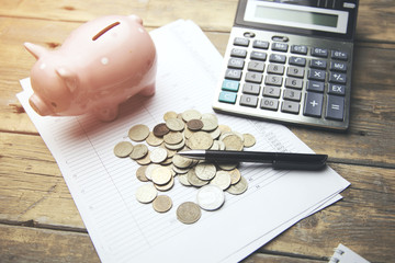 piggy bank ,coins and calculator