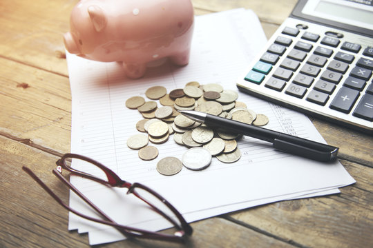 piggy bank ,coins and calculator