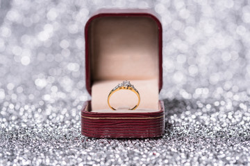 gold ring with diamond. Jewelry with bokeh background