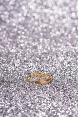 two gold ring with diamond. Jewelry with bokeh background