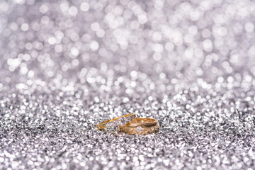 two gold ring with diamond. Jewelry with bokeh background
