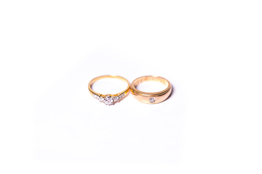 two gold ring with diamond. Jewelry with white background