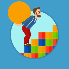 Man carrying concrete ball uphill.