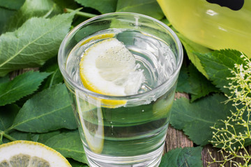 Glass of water with Elderflower Syrup and Lemon