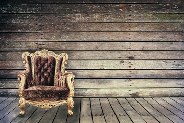 Empty vintage chair in grunge old wooden room