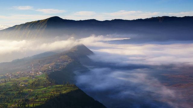 4K Timelapse of morning mist at Cemoro Lawang village near Bromo volcano, Indonesia
