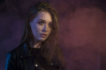 Beautiful teenager girl in a dark hallway