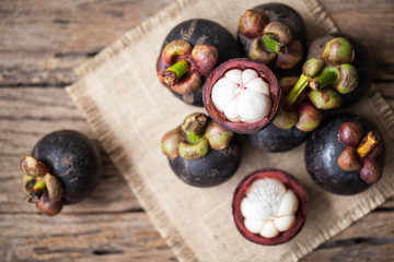 Mangosteen fruit on wooden background