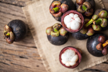 Mangosteen fruit on wooden background
