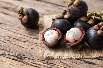 Mangosteen fruit on wooden background
