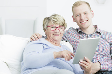 Modern grandmother using tablet