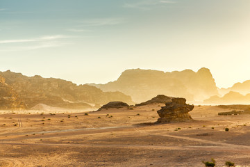 Desert Landscape of Wadi Rum in Jordan, with a sunset, stones, b