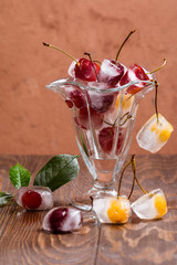 Cherry in ice cube in glass bowl 