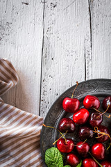 fresh cherries on wooden table
