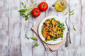 Delicious grilled pumpkin and arugula  salad 
