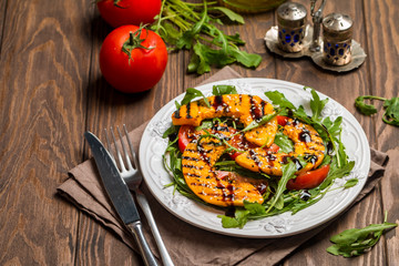 Delicious grilled pumpkin and arugula  salad