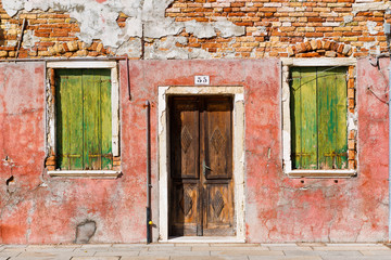 Colorful house facade in Burano, Italy