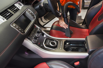 Cleaning of interior of the car with vacuum cleaner