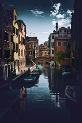 Fototapeta premium Street scene with canal in Venice, Italy