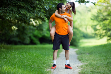 Man carrying woman piggyback