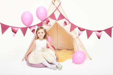 Little girl playing in a tent © kegfire