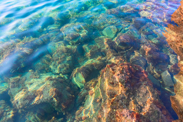 Fototapeta na wymiar Stones under water, shallow depth, selective focus