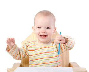 A boy draws with a pencil , isolated on white background