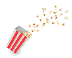 Popcorn with flying kernels from red white cardboard box