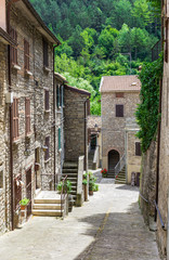 typical Italian street in a small provincial town of Tuscan, Ita