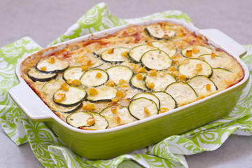 casserole with zucchini, corn and potato in baking dish