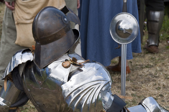Tewkesbury, UK-July 17, 2015: Knight in armour from rear on 17 July 2015 at Tewkesbury Medieval Festival