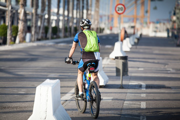 Fototapeta na wymiar Cyclist riding in the city.